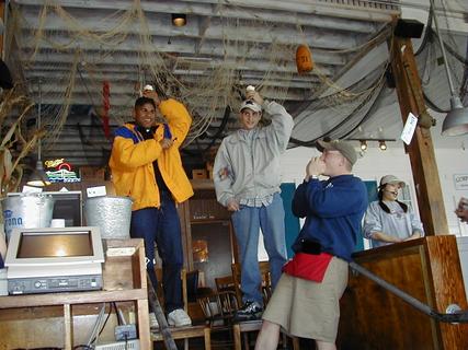 Two guys having happy birthday sung for them.  We were just having lunch in this restaurant on Pier 39 when they got these guys to stand up with ice cream on their heads and everyone sung happy birthday to them.. weird stuff!<br>Location: <a href="https://www.google.com/maps/search/?api=1&query=37.81121,-122.41031" target="_new">Bubba Gump Shrimp Co., Pier 39, Fisherman's Wharf</a>
